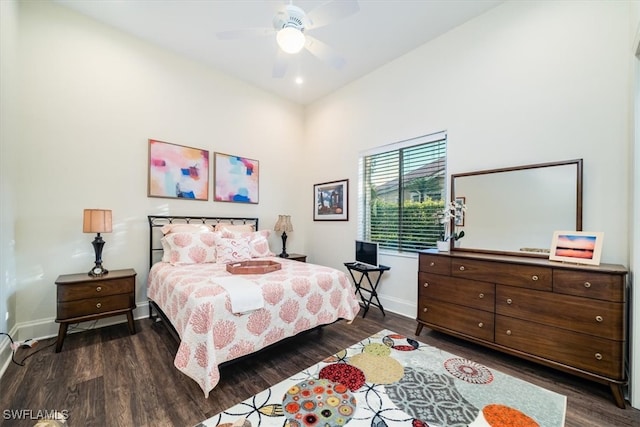 bedroom featuring dark wood-type flooring and ceiling fan