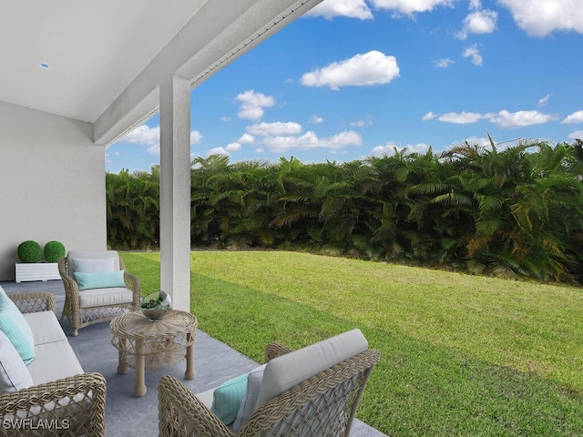 view of yard with an outdoor living space and a patio