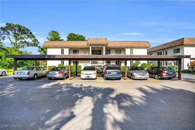 view of vehicle parking featuring a carport