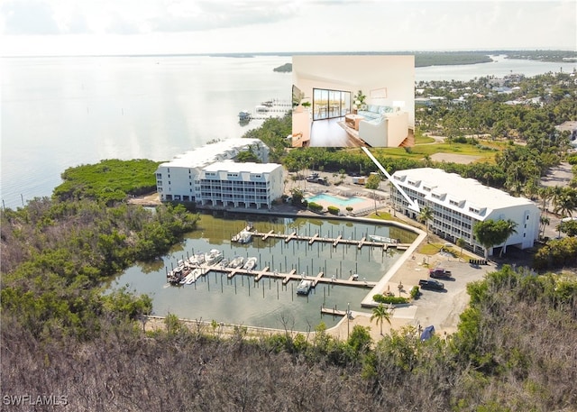 birds eye view of property with a water view