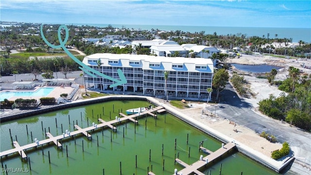 birds eye view of property with a water view