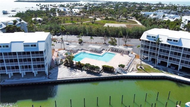 birds eye view of property with a water view