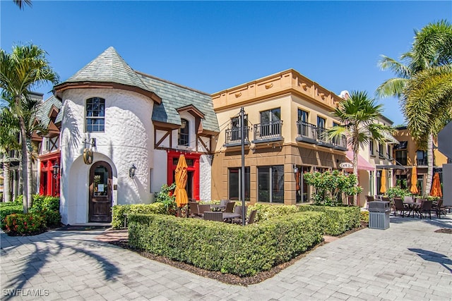 view of front of home with a balcony