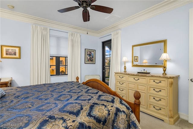 carpeted bedroom featuring ceiling fan and crown molding