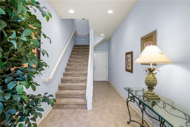 stairs with tile patterned floors