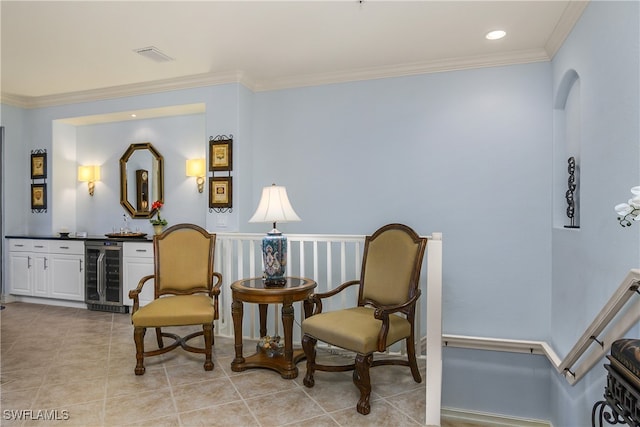 living area featuring light tile patterned floors, indoor bar, wine cooler, and ornamental molding