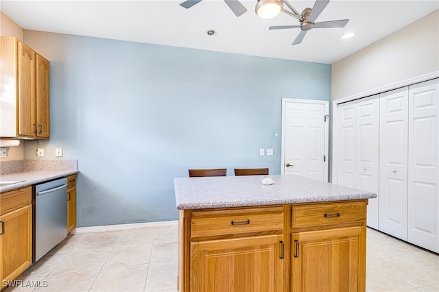 kitchen with a center island, ceiling fan, dishwasher, and light tile patterned floors