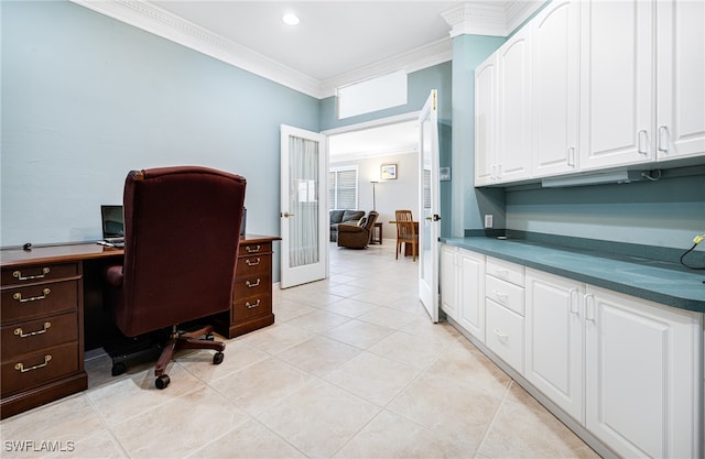 home office featuring light tile patterned floors and crown molding