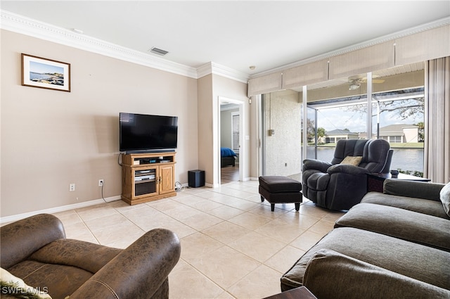 living room with light tile patterned floors, ceiling fan, and ornamental molding