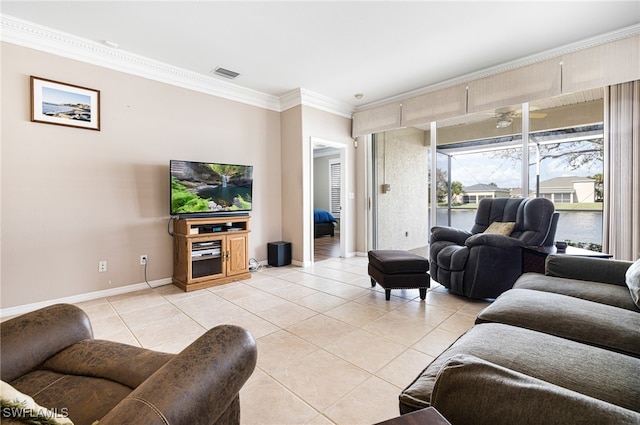 living room with ceiling fan, light tile patterned floors, and ornamental molding