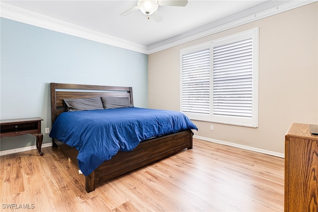 bedroom featuring ceiling fan, hardwood / wood-style floors, and ornamental molding