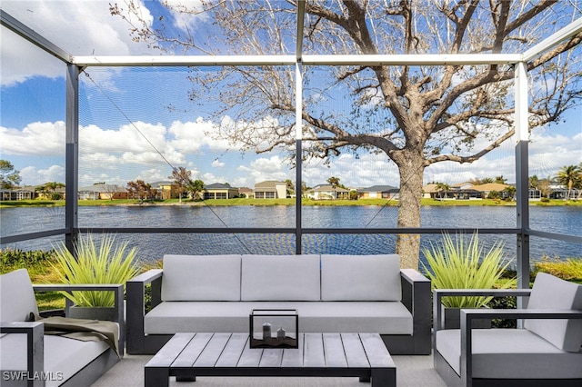 unfurnished sunroom featuring a water view