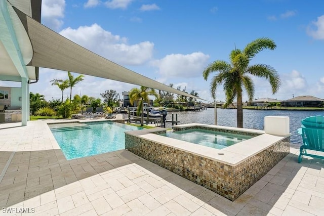 view of swimming pool with an in ground hot tub, a patio, and a water view