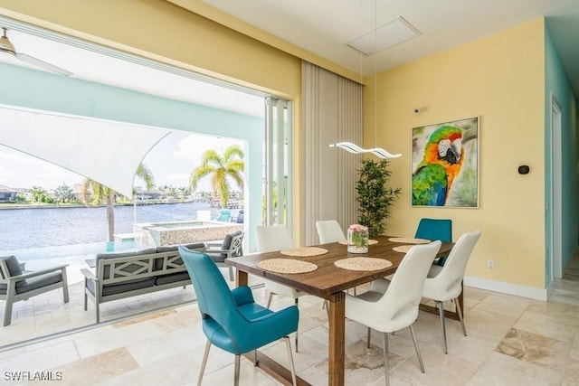 dining area featuring a water view