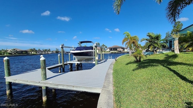 dock area featuring a yard and a water view