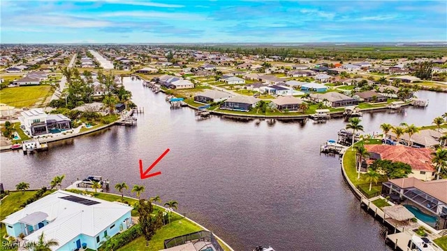 birds eye view of property featuring a water view