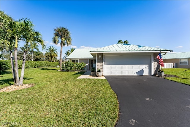 ranch-style home with a front yard and a garage