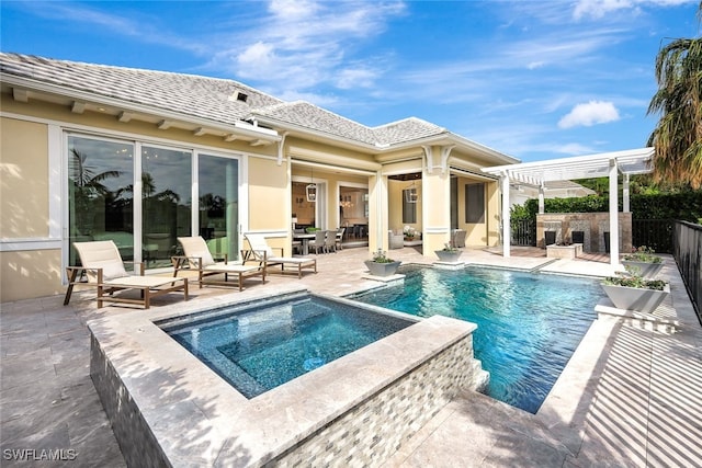 view of swimming pool with a pergola, a patio area, an in ground hot tub, and exterior fireplace