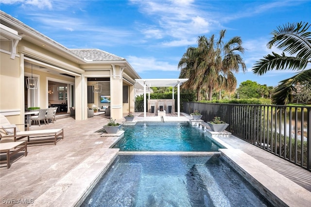 view of pool featuring pool water feature, an outdoor bar, and a patio area