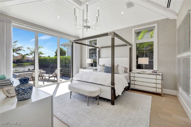 bedroom with access to outside, beam ceiling, a water view, a notable chandelier, and light hardwood / wood-style floors