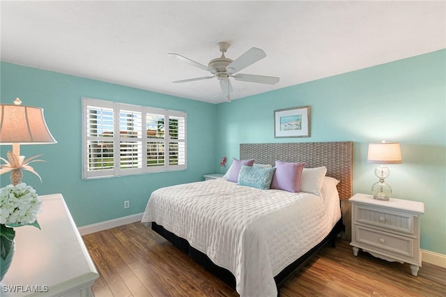 730 W Elkcam Cir Unit 205, Marco Island, FL 34145 - bedroom with baseboards, wood finished floors, and a ceiling fan