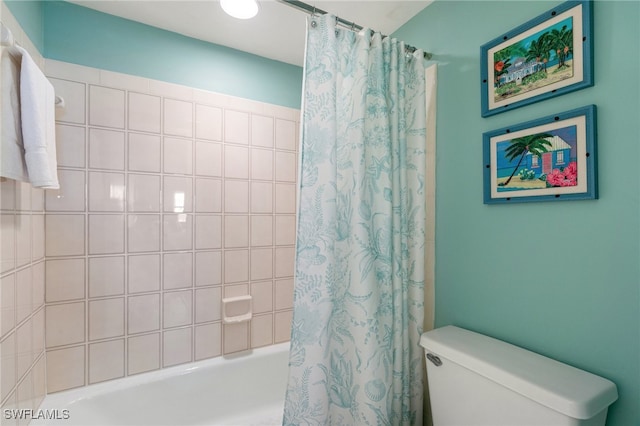 bathroom featuring toilet and shower / tub combo