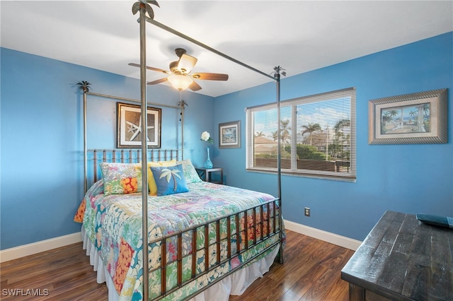 bedroom with ceiling fan and dark hardwood / wood-style floors