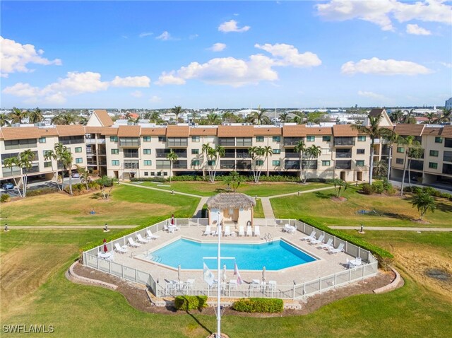 view of pool with a lawn and a patio area