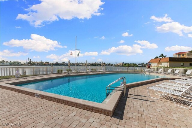 730 W Elkcam Cir Unit 205, Marco Island, FL 34145 - community pool featuring fence and a patio area