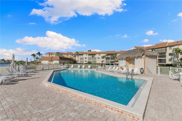 view of swimming pool with a patio