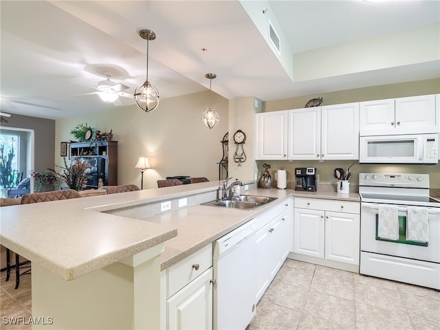 kitchen with kitchen peninsula, white appliances, sink, white cabinetry, and hanging light fixtures