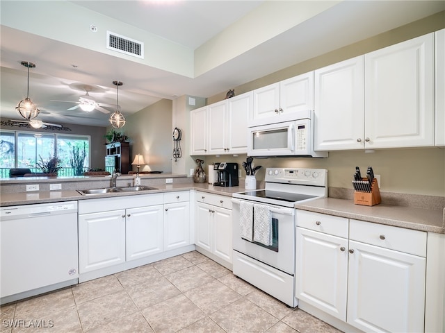 kitchen with pendant lighting, white appliances, sink, ceiling fan, and white cabinetry