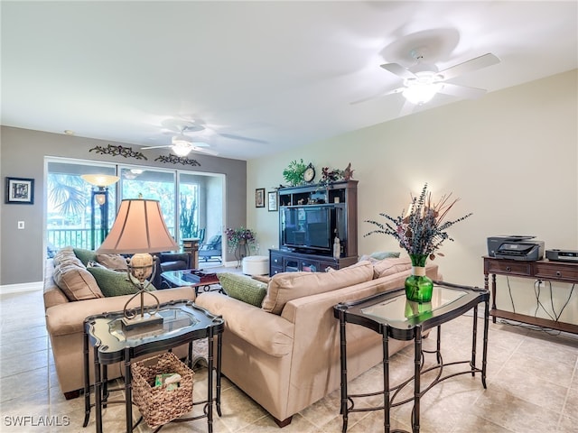 tiled living room with ceiling fan