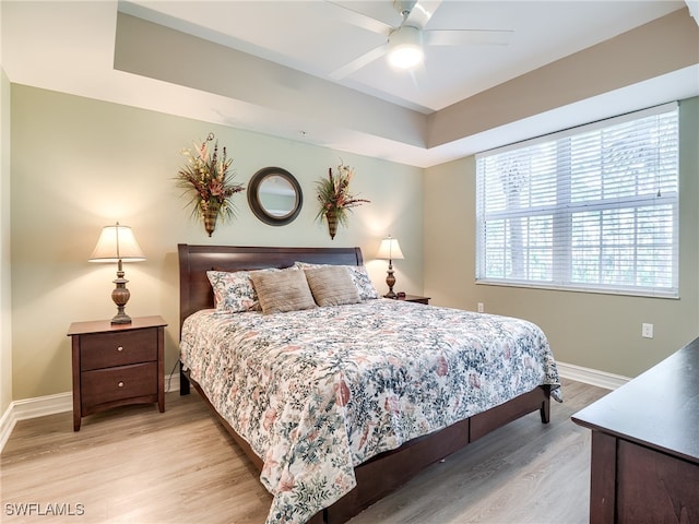 bedroom featuring ceiling fan and light hardwood / wood-style floors