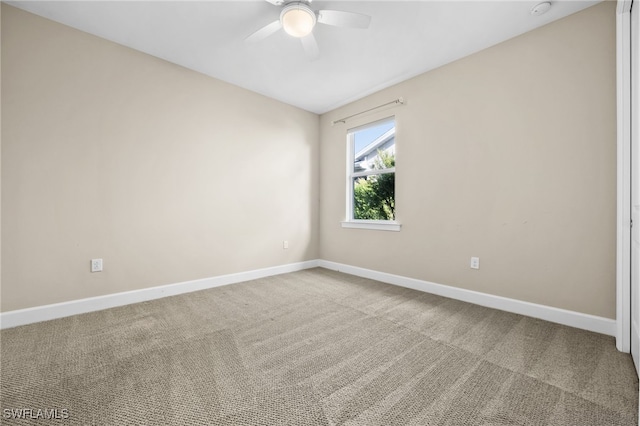 unfurnished room with carpet and ceiling fan