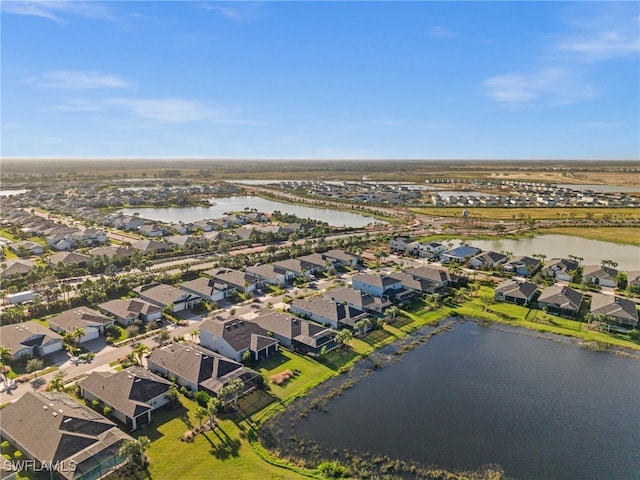 bird's eye view with a water view