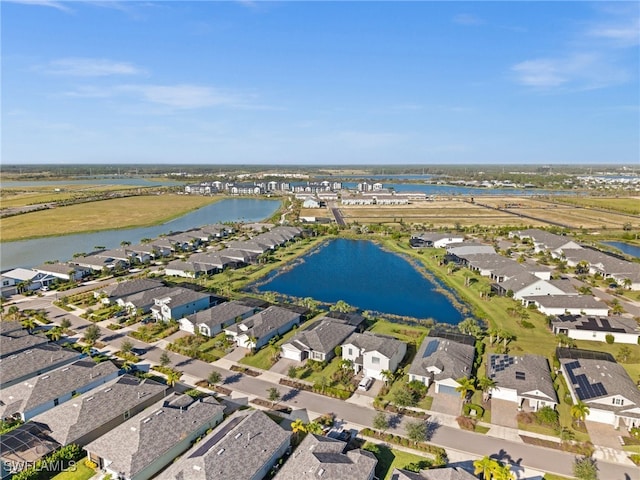 drone / aerial view with a water view