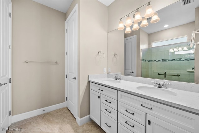 bathroom with walk in shower, vanity, and tile patterned flooring