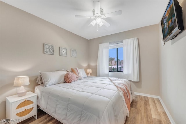 bedroom featuring light wood-type flooring and ceiling fan