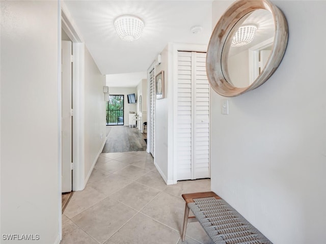 corridor with light tile patterned floors