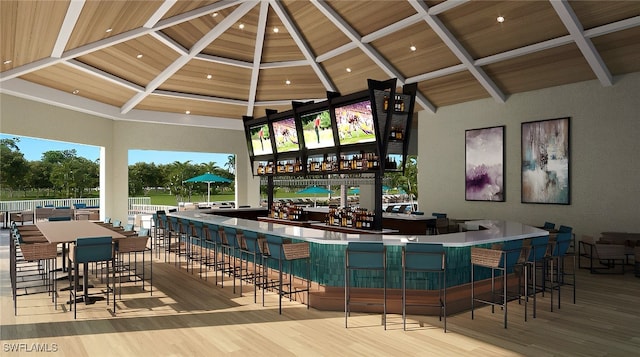 bar featuring high vaulted ceiling, wood ceiling, and light hardwood / wood-style flooring