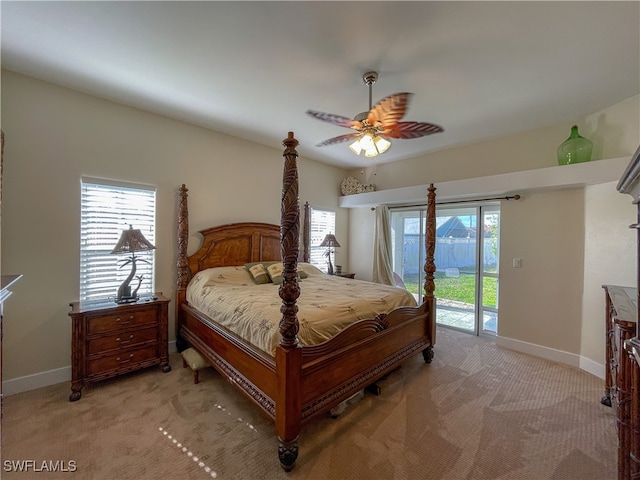 bedroom featuring light carpet, access to exterior, and ceiling fan