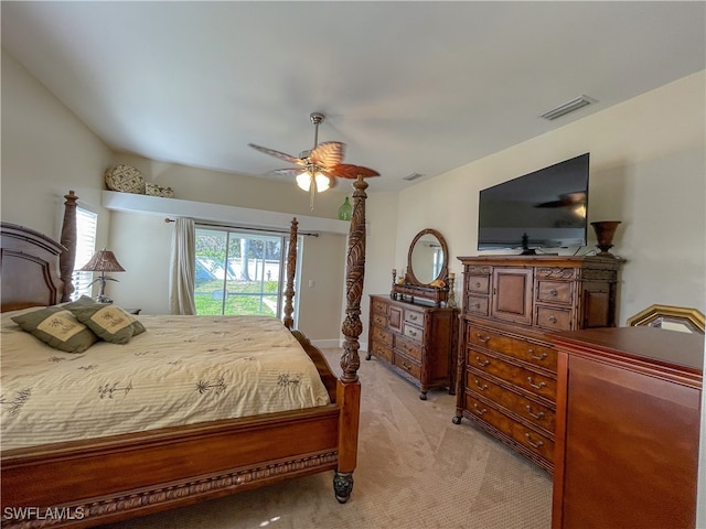 bedroom with ceiling fan, light carpet, and access to outside