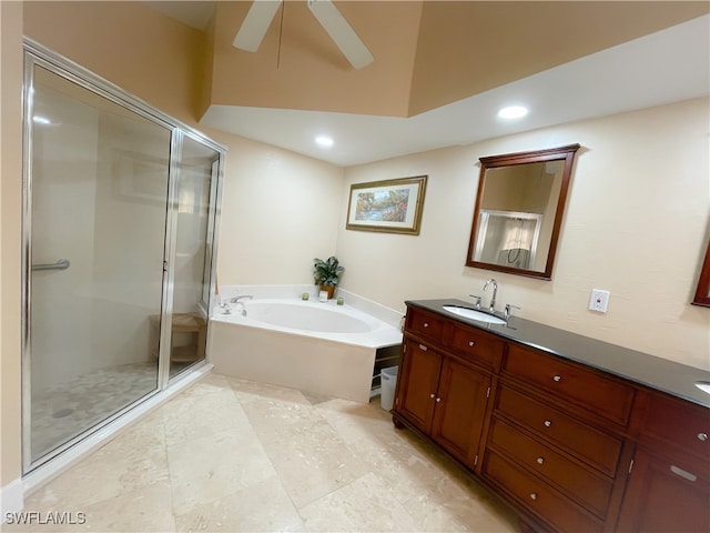 bathroom with ceiling fan, vanity, and separate shower and tub