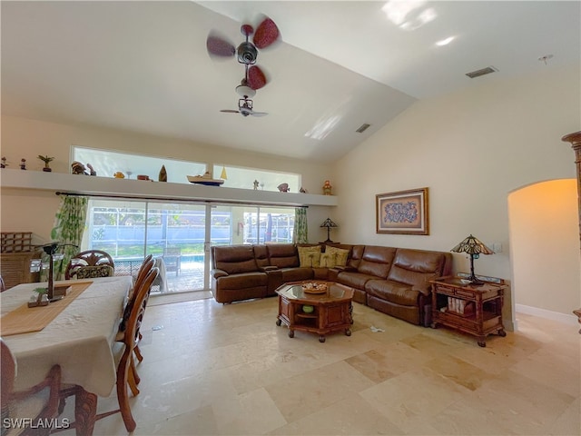 living room featuring high vaulted ceiling and ceiling fan