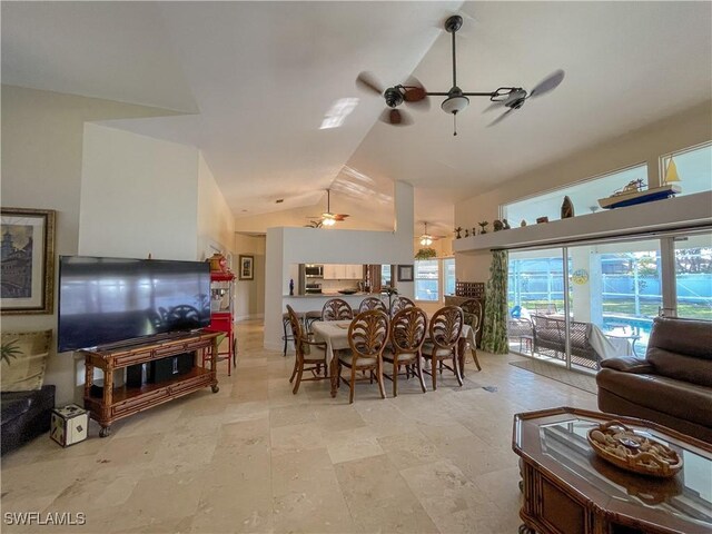 dining area featuring vaulted ceiling and ceiling fan