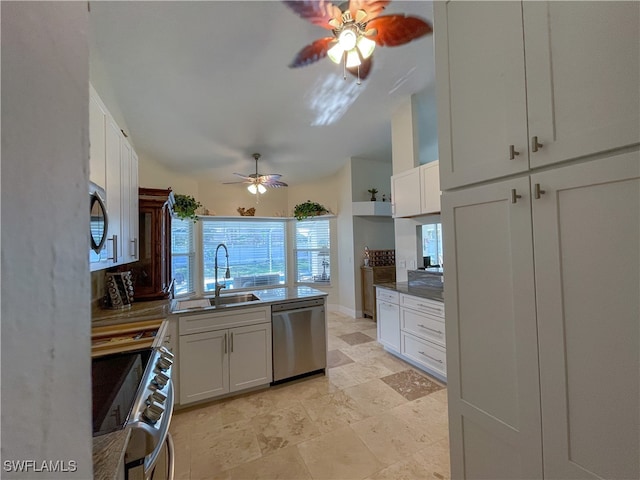 kitchen featuring white cabinetry, appliances with stainless steel finishes, sink, and ceiling fan