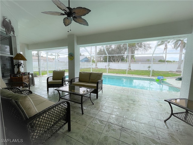 view of pool featuring an outdoor hangout area, a patio, ceiling fan, and glass enclosure