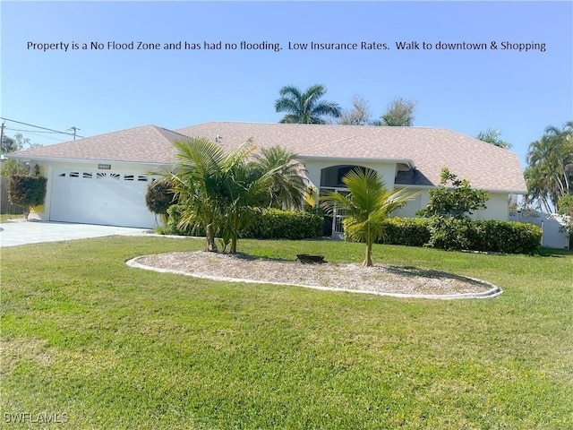 view of front of house with a garage and a front yard