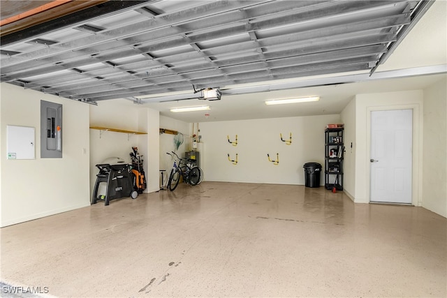 garage featuring electric panel and a garage door opener